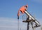 Oil well gas and gasoline well against the blue sky, close-up, Extraction of petroleum, equipment, extraction, environment