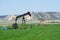 Oil well pumping in a rural Nebraska field