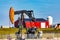 Oil well pumpjack in rural landscape