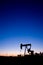 Oil well pumpjack sunset