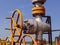 Oil well wellhead . Hand valve with handwheel for opening and closing the flow line