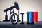 OIL word made black letters and oil pump, barrels on the background/