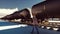 Oil worker walks past the railway with Rail tank cars driving on it. 3D Rendering