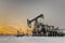 Oilfield during sunset in winter time