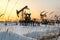 Oilfield during sunset in winter time
