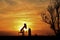 Oilwell Pump Silhouette with a colorful Sunset and tree`s in Kansas.