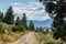 Okanagan Valley, Canada - August 04, 2018: Kettle Valley Railway biking trail through orchards near Penticton Canada.