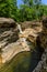 Okatse first canyon and small Kinchkha waterfall in the canyon of the river Okatse. Rest in Georgia. Rocky ledges of the