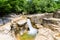 Okatse first canyon and small Kinchkha waterfall in the canyon of the river Okatse. Rest in Georgia. Rocky ledges of the