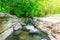 Okatse first canyon and small Kinchkha waterfall in the canyon of the river Okatse. Rest in Georgia. Rocky ledges of the mountain