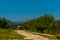 OKATSE, GEORGIA: A beautiful scenic road that leads to Okatse Canyon on a sunny summer day.