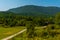 OKATSE, GEORGIA: A beautiful scenic road that leads to Okatse Canyon on a sunny summer day.