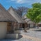 Okaukuejo resort with thatched roof houses and campsite in Etosha National Park