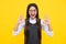 Okay. Young girl child show fingers ok symbol sign language  on yellow background. Funny teenager face. Excited