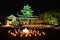 Okayama castle with lanterns light-up at night in Okayama, Japan