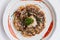 Okonomiyaki is a Japanese savoury pancake containing a variety of ingredients