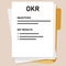 OKR objectives and key results list on paper tracking employee measure target in company