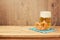 Oktoberfest german beer festival background with beer glass and pretzel on wooden table