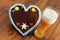 Oktoberfest gingerbread heart cookie with copy space and weissbier glass