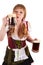 Oktoberfest girl blows with beer foam