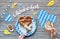 Oktoberfest, traditional festival food: white sausages, pretzel and beer. flat lay on rustic wooden table with blue and white chec