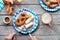 Oktoberfest traditional food and beer, flat lay on wooden table