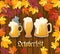 Oktoberfest .Traditional German autumn festival of beer background.Three mugs of beer on a wooden background with frame