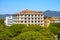 Olbia, Italy - Panoramic view of Olbia port area and Grand Hotel President with Cabu Abbas hills in background