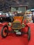 Old 1912 Ford Model T open runabout roadster on a red carpet. Font view. Classic car show.