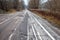 Old abandoned asphalt road with spoiled road markings