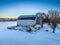 Old abandoned barn and winter landscape