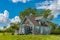 Old, abandoned blue prairie farmhouse in the ghost town of Kayville, Saskatchewan, Canada