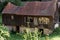 Old abandoned and broken barn with broken windows and roof