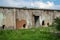 An old abandoned building. Former warehouse of fruits and vegetables in the 1980s. Holes in the walls