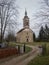 An old abandoned church building in a dilapidated condition against a gloomy sky during the cloudy day