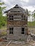 Old abandoned collapsing house cloudy day