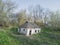 Old abandoned destroyed Ukrainian hut. Deserted rural home