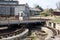 Old abandoned empty train depot with warehouses and wagons of trains and trams