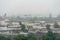 old abandoned factory building in the middle of a green forest. Panorama of the city with a view of factories and enterprises.