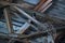 Old, abandoned factory. Scattered glass, iron, wooden remains of the production on the floor, covered with snow and sawdust.