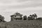 Old abandoned farmhouse in corn field