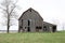 Old abandoned farmhouse under the whi sky in countryside