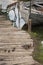 Old, Abandoned fishing boat on the docs with ducklings