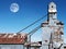 Old Abandoned Granary with Painted Signs with Full Moon