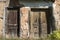 Old abandoned grunge rural house doors