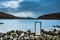 An old abandoned hamlet in the Faroe Islands. Mountains and lake on background