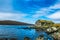 An old abandoned hamlet in the Faroe Islands. Mountains and lake on background