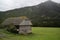 Old, abandoned house in countryside house with mossy roof