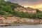 Old abandoned house at the hills of Kinaliada island in Marmara Sea, with dense trees, at sunrise, Istanbul, Turkey