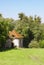 Old abandoned lodge with slate roof near forest